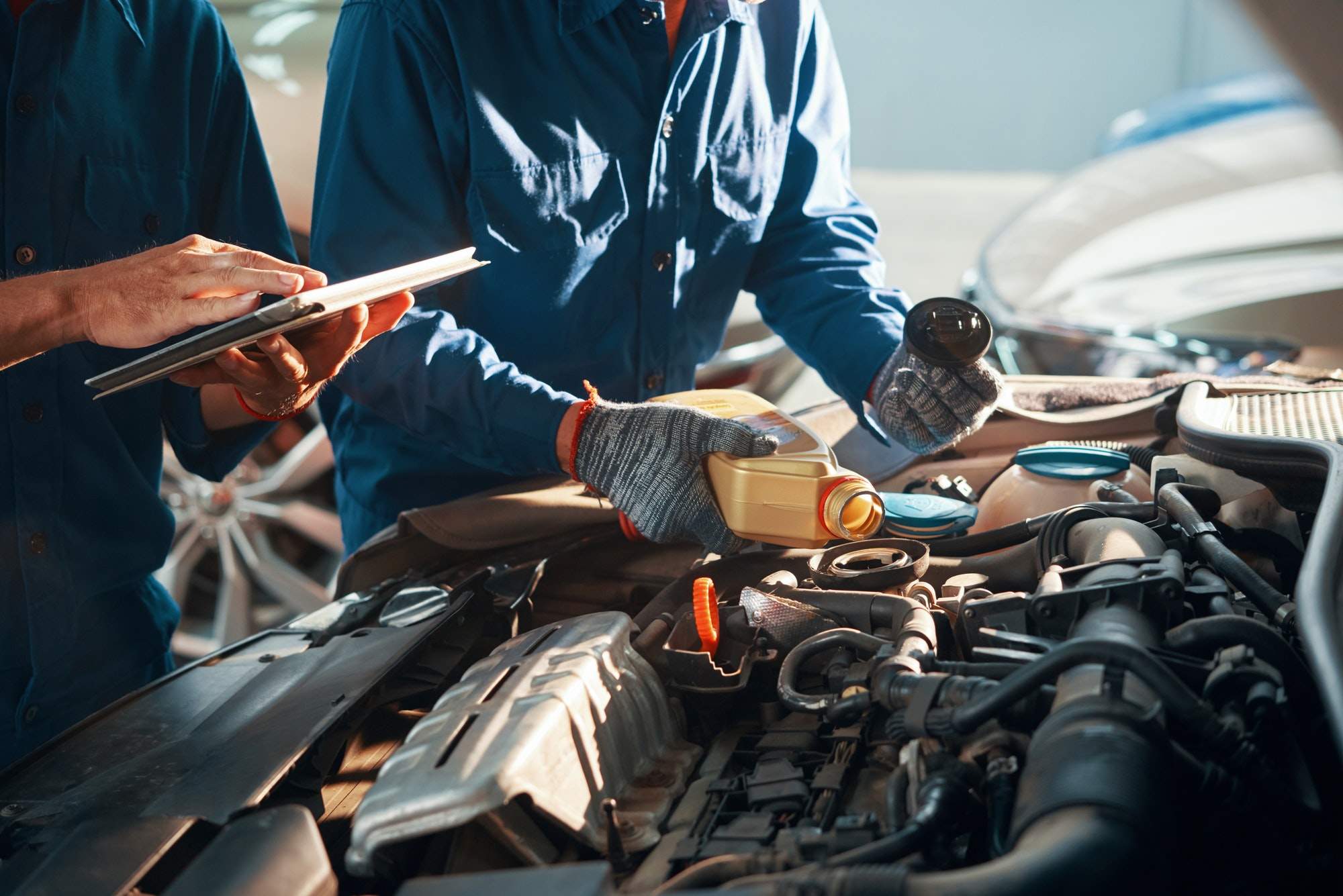 Pouring oil in engine